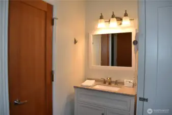 Vanity is primary full bath with a separate room for tub/shower and toilet.