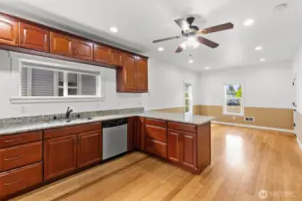 Big kitchen with plenty of cabinets, slab granite countertops and a great layout.