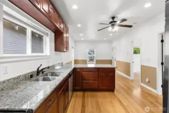 Big kitchen with plenty of cabinets, slab granite countertops and a great layout.