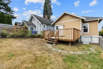 Bid deck in the back with a fully fenced portion perfect for pets.