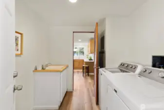 Laundry room and mud room with access out to the carport