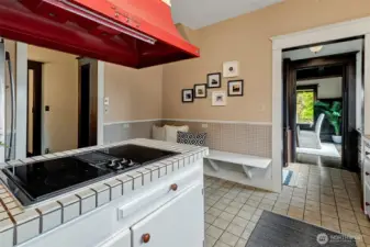 Cheerful kitchen with eating space for cozy mornings and casual dining. Butler's pantry between kitchen and dining room helps with meal and beverage prep for special occasions.