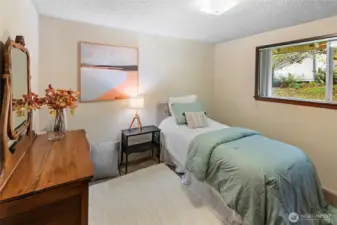 2nd bedroom looks out on the back yard, has room for a queen bed.