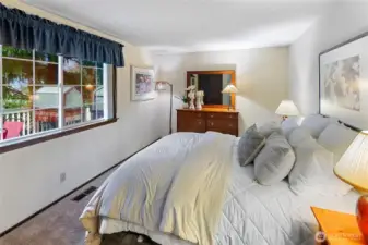 Primary Bedroom has great morning light and looks out onto the deck.