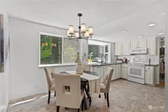 Lovely casual eating space in the kitchen, with a stylish new light fixture above the dining table.
