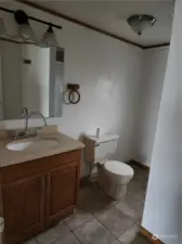 Bathroom.  Shower is opposite commode