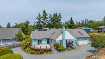 The home features a two car garage with a 220 EV ready outlet, and parking for an RV, boat or both!