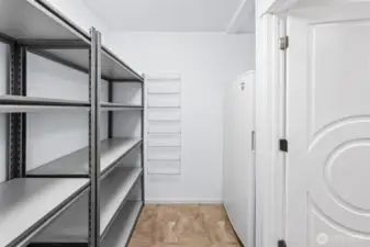 Enormous walk in pantry complete with versitile shelving and freezer nook