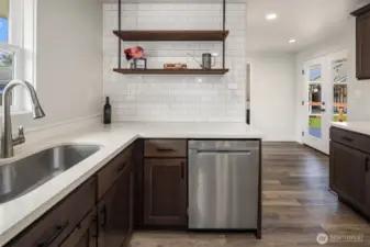 French doors just west of kitchen to access deck and back yard; great for outdoor BBQs!