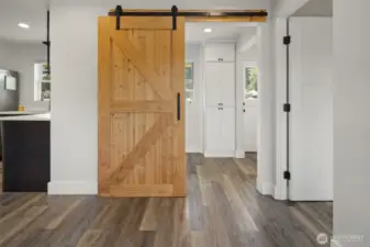 Barn door separates laundry area from main living area