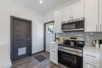 Washer and dryer off kitchen