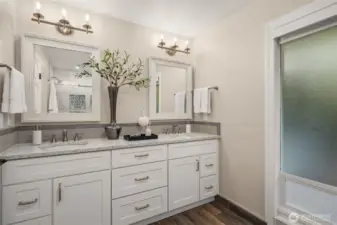 The remodeled primary bath features a large dual vanity.
