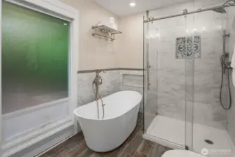 The primary bath also features a seperate shower and vessel tub.