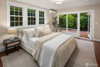 This bedroom also offers access to a private patio.