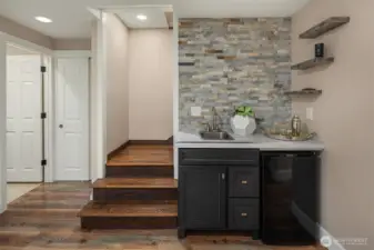 The family room also offers a wet bar, perfect for entertaining, watching football or a movie.