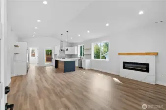 Light filled living area with vaulted ceiling.