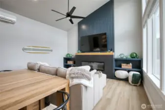 Bright, modern vibes with luxury vinyl plank flooring throughout, ceiling fan, electric fireplace and mini-split heat pump for year round comfort