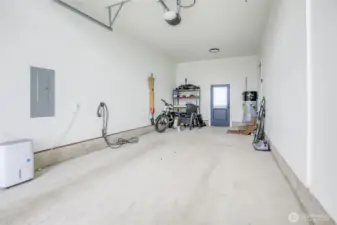 28' extra deep garage with EV charger, remote control garage door opener and door to the backyard