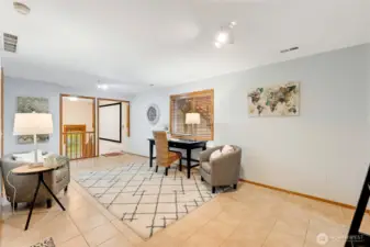 A versatile lower-level layout with easy access to the laundry and bath. The open design allows for multiple uses such as a home workspace, hobby area, or cozy den.