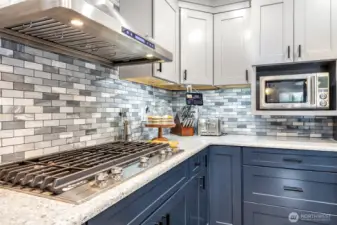 This gas range is amazing! Upgraded hood vent as well