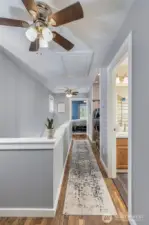 Hallway upstairs with main bedroom in the background