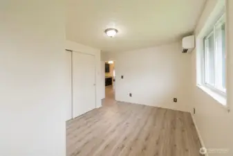 Light-filled bedroom with flexible use options.