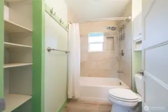 Full bathroom with tub/shower combo.