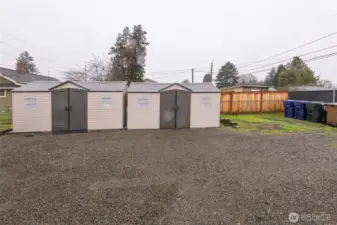 Two detached sheds offer convenient outdoor storage.