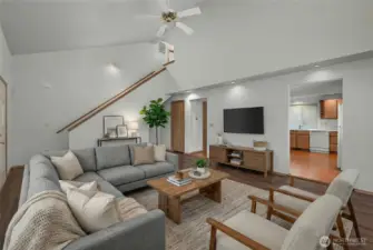 Bright living room with functional layout, natural light, and easy flow into the kitchen and dining areas.