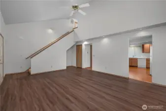 Bright living room with functional layout, natural light, and easy flow into the kitchen and dining areas.