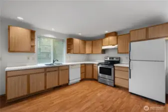 Efficient kitchen with ample cabinetry, counter space, and direct connection to the main living areas.