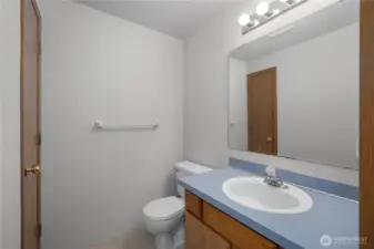 Convenient half bathroom located off the main living areas, ideal for guests.