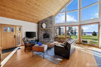 Welcome Home. As you enter, you are greeted with cathedral tongue and groove ceilings, hardwoods, sunshine, and light in the open concept living area.