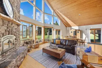 Inviting, cozy and relaxing.  Floor to ceiling stone fireplace, wall of windows for those gorgeous views. of Mountain, Sound & Island.  Not to mention whales, blue herons, eagles and more