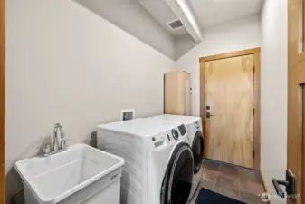 Laundry, wash basin as you go to the garage