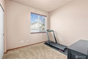 One of three spacious bedrooms, office, or workout room