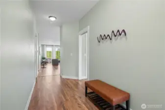 Entering unto this beautiful home, it offers wide hallways and laminate flooring.