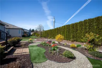 completely redesigned front & back yard, has many plants and flowers and artificial grass so you don't have to mow!!