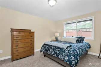 Generous room with lovely windows to the fenced back yard. Private & quiet area! Walk in closet and attached full bathroom to the right.