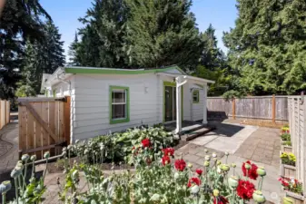 Back of front house with large back patio perfect for BBQ-ing!