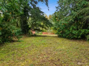 From the Entry of the Property, View toward the East Property Line (behind the Conex). Partially Fenced along the East Property Line.