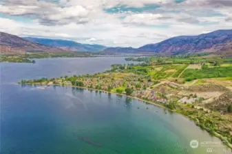 In the Sunny Okanogan Valley surrounded by the rugged hills.