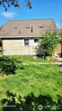 Back of home has a huge yard.