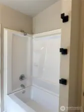 Primary bath new tub surround with towel hooks