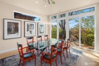 A formal Dining Room with gallery wall space is just steps from, both, the kitchen and the outdoors