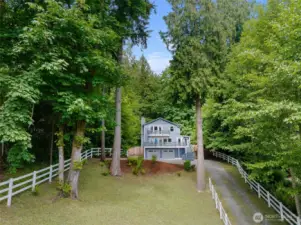 Nestled on a serene .4-acre lot in Suquamish, this charming home offers peek-a-book views of Agate Passage, full southern exposure, and ample privacy in a peaceful wooded setting.