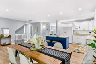 Open concept with seamless integration of kitchen and dining room areas, perfect for entertaining.