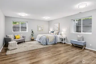 Spacious finished basement featuring two egress windows that fill the area with natural light. With the addition of a full bathroom, this space is ideal for an additional bedroom, guest suite or flex living space.