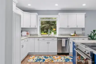 Light and bright kitchen, with atrium style garden window above sink, perfect for herbs, indoor plants or decorations.