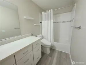 Gorgeous bathroom with tile shower.